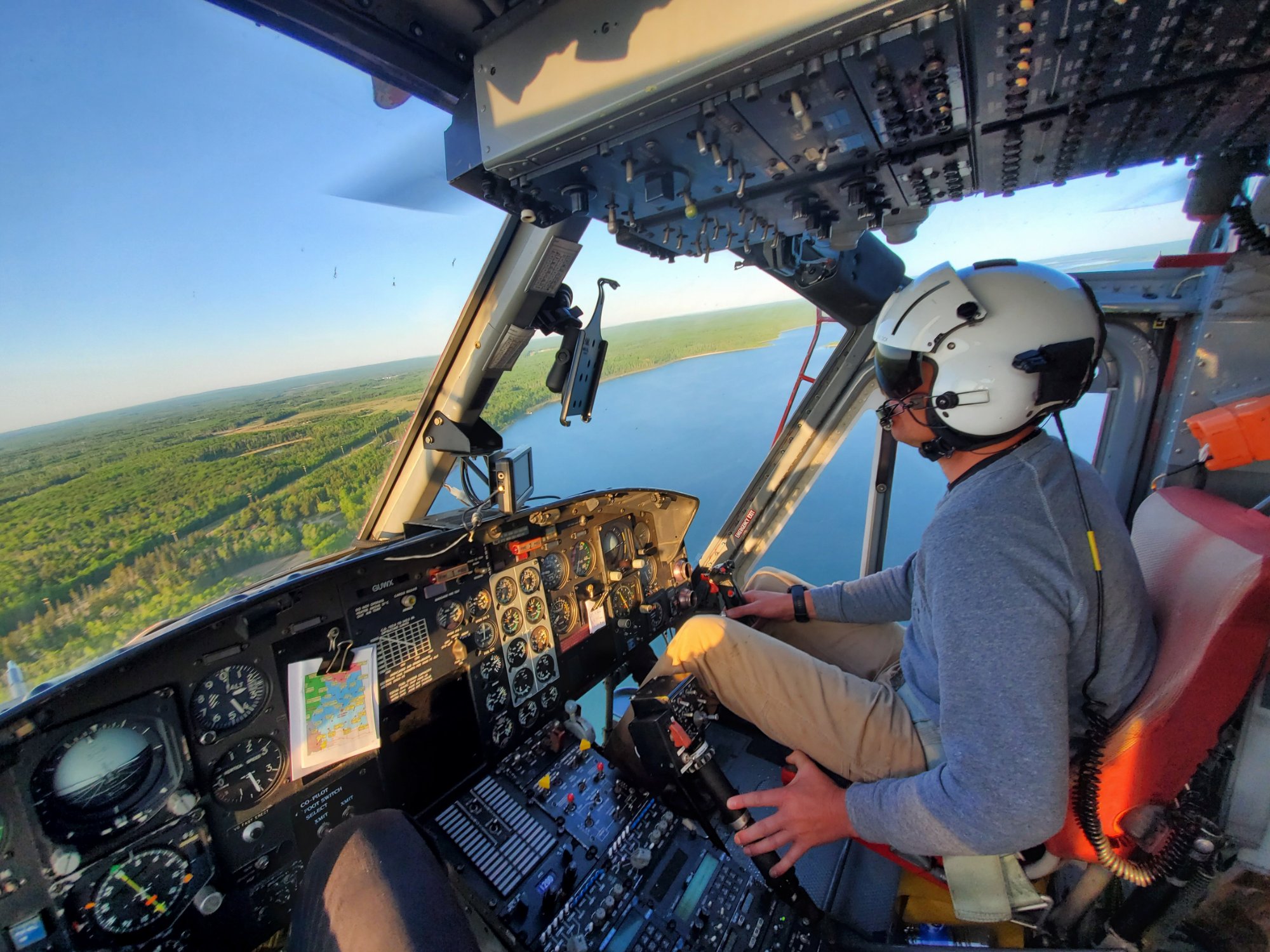 Bell 212 cockpit over lake — May 2019